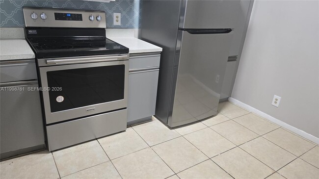 Building Photo - 8901 Wiles Rd Unit 303