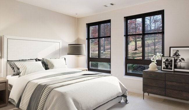 Spacious bedrooms with large windows providing ample natural light