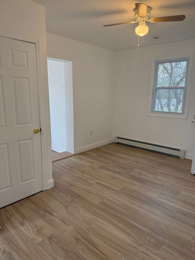 Living room with coat closet. - 410 E Point Pleasant Ave Unit Rear