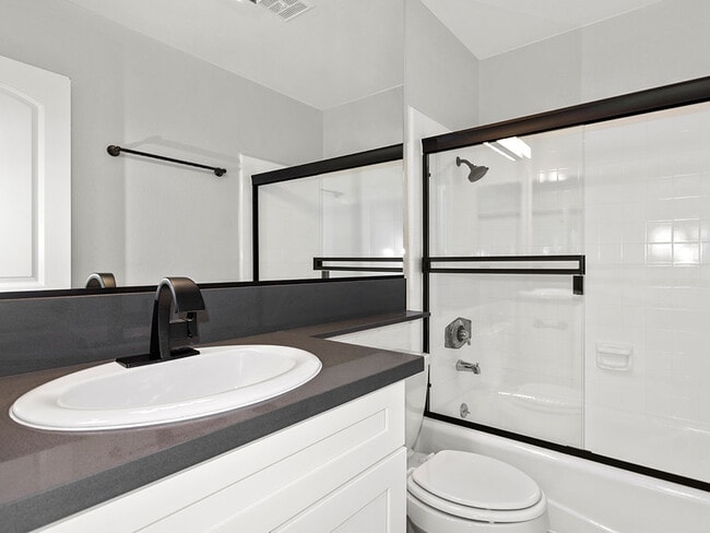 Modern styled bathroom with shower and tub.