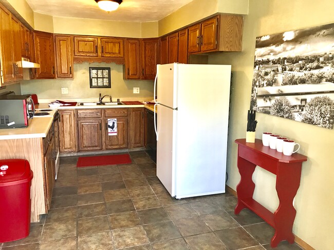 Kitchen filled with everything you need for dining in. - 502 Crab Apple Court Unit Industrial Rooster