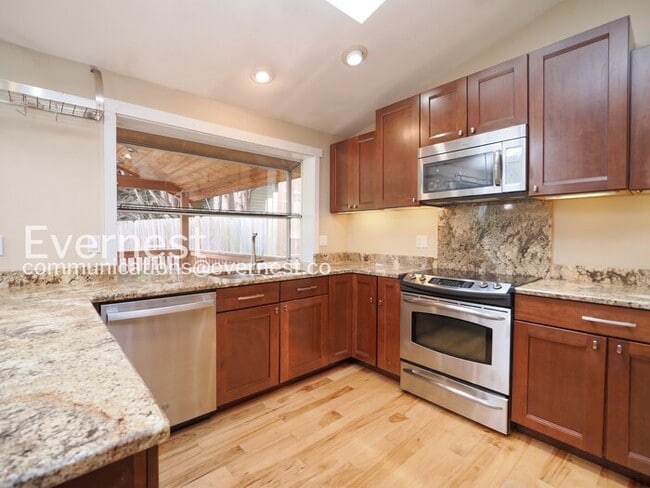 Photo - 3 Bed, 2 Bath Home with Fenced Yard & Garage / Available Soon!