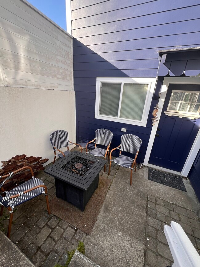 Shared patio space with garden seating. - 41 Ocean View Ave