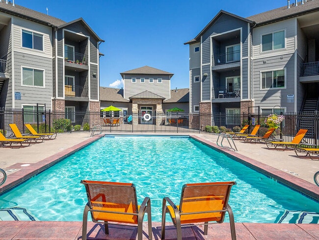 Poolside Relaxing Area - Four Seasons at Southtowne Apartments
