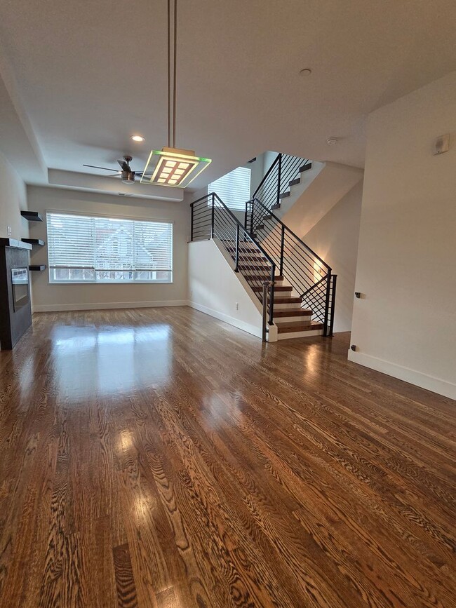 Photo - STUNNING 4-LEVEL TOWNHOME IN HIGHLANDS WITH SAUNA, 2-CAR GARAGE + AMAZING ROOFTOP DECK!