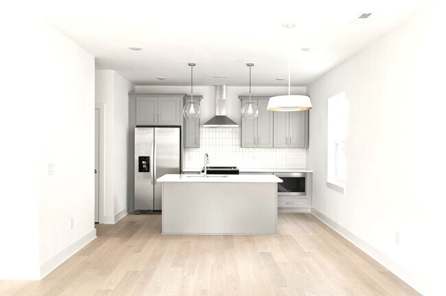 Photo - New construction three-story townhome offe...