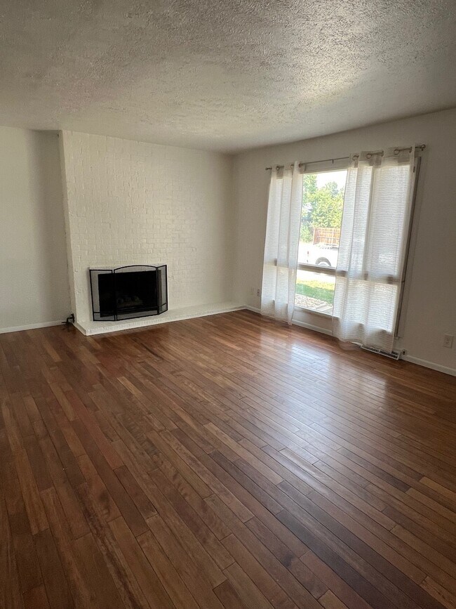 Main Living room, fireplace and tons of natural light. - 6396 E Mississippi Ave Unit 6396 E Mississippi Ave