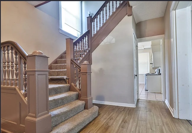 Photo - Bright 4-Bed Home with Fenced Yard, Central HVAC, and 3 Finished Levels