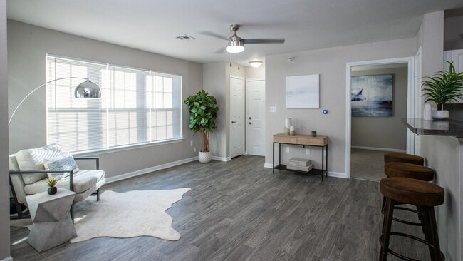 Our inviting living room boasts large, picturesque windows that usher in abundant natural light, infusing life and vibrancy into your space. Whether you seek relaxation, productivity, or entertainment, this welcoming oasis is prepared for all your needs.