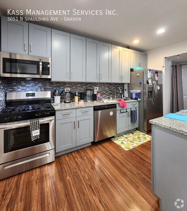 Building Photo - 3051 N Spaulding Ave Unit Garden Rental