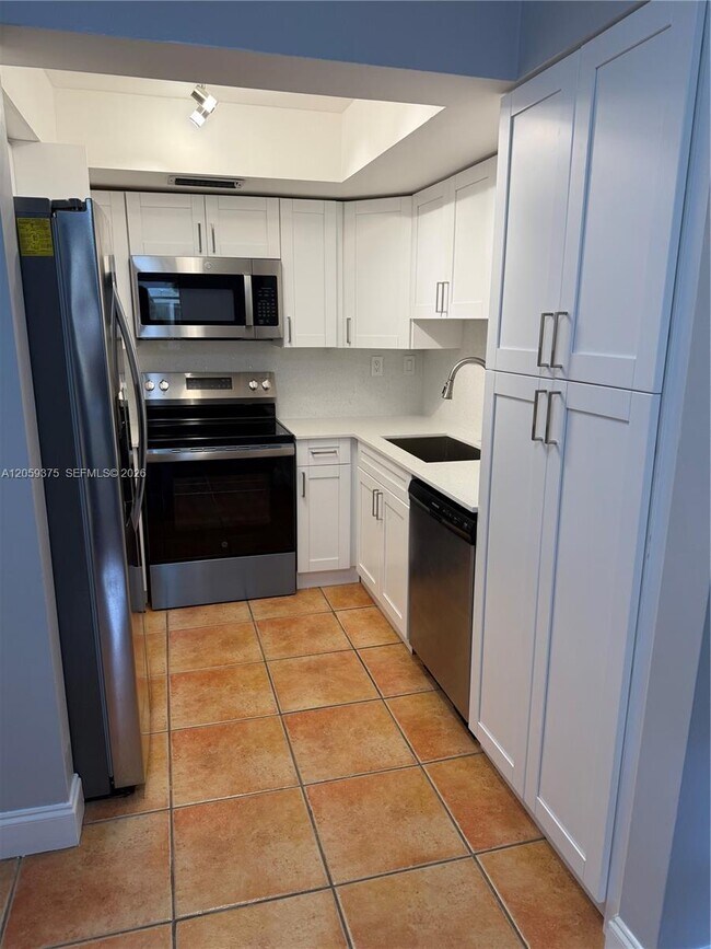 Building Photo - 8810 SW 123rd Ct Unit M-209