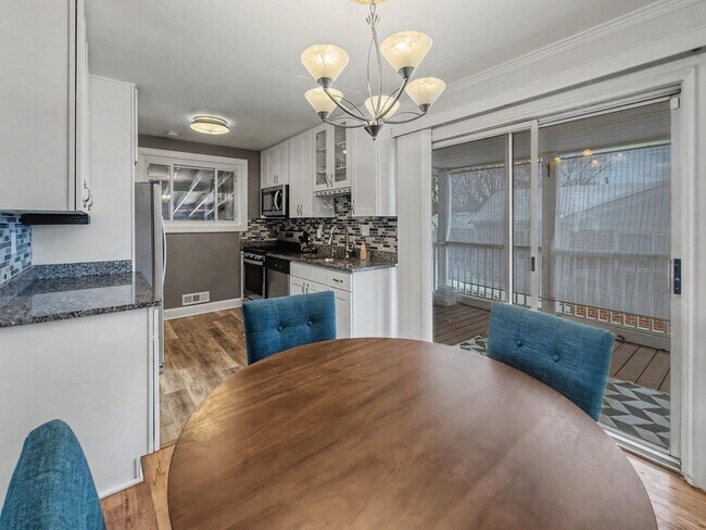 Photo - Furnished 4BD 2BA Home with Two kitchens, Basement, and Garage!