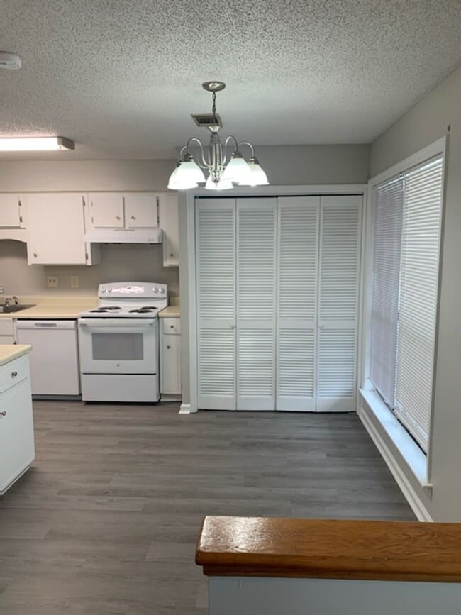 Photo - This charming 3-bed, 2.5-bath townhome is available for rent.