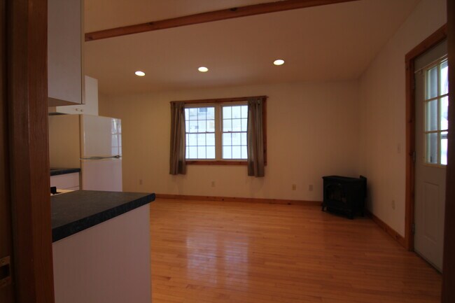 Looking from bedroom into open concept kitchen/livingroom - 37 Court St Unit Apt. C