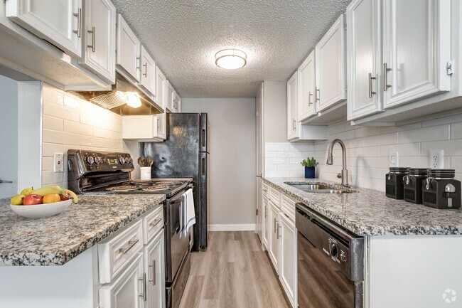 This gorgeous renovated kitchen boasts modern appliances, updated countertops, and elegant finishes, creating the perfect space for cooking and entertaining. - Villa De Oro Rental