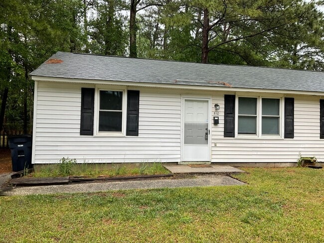 Building Photo - This two bedroom one bath duplex is centrally located. Just minutes to area bases, beaches, shopp...