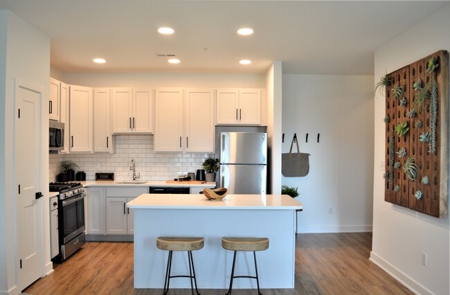 Open Kitchen with Island - The Reserve on East Apartments