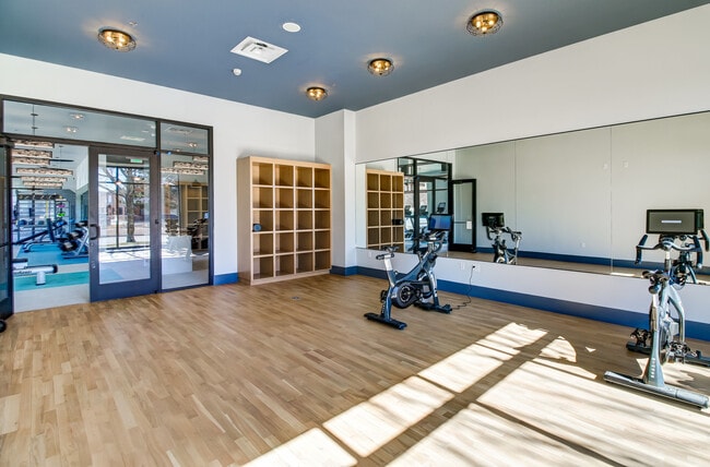 Yoga studio with spin bikes and virtual fitness programming