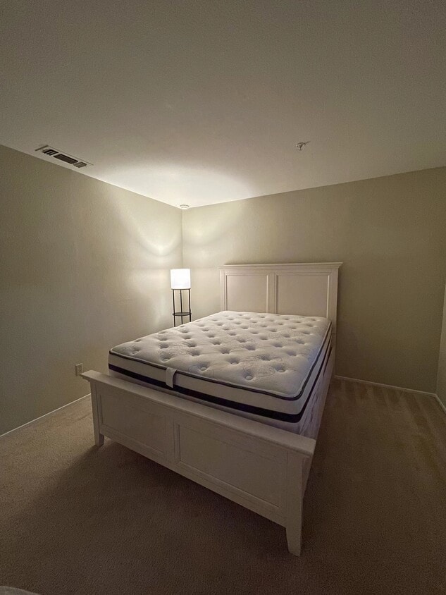 Bedroom with queen side bed and light - 480 Bollinger Canyon Ln (San Ramon, CA)