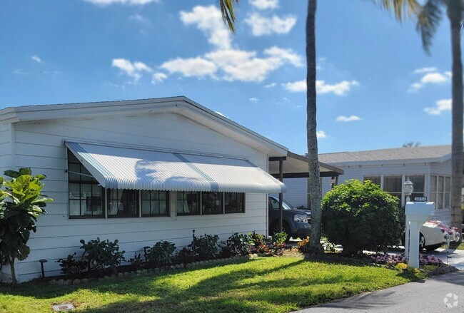 Beautiful updated 2-bedroom, 2-bathroom mobile home in the sought-after Palm Breezes Club community. - 3404 Seacoast St Rental