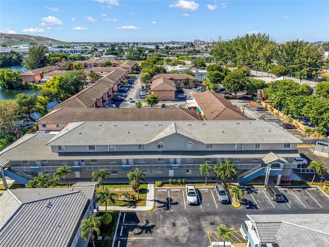 Building Photo - 8390 NW 103rd St Unit 102H