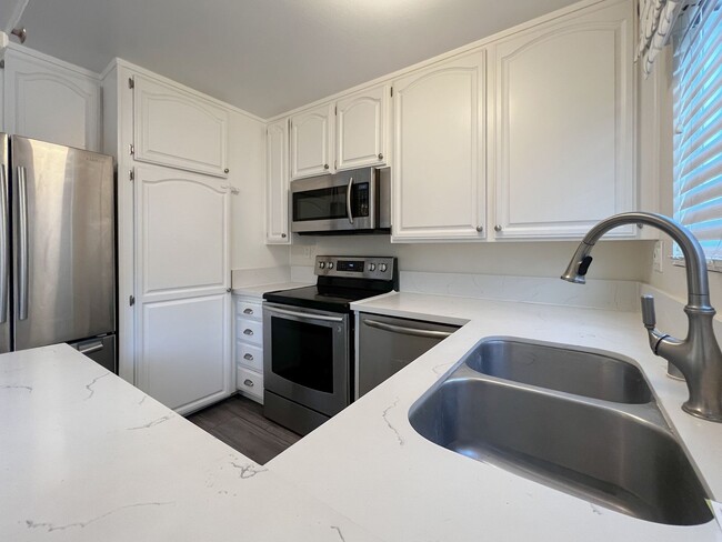 Photo - BEAUTIFUL 2 STORY TOWNHOUSE STYLE WITH A/C,  WASHER/DRYER, POOL, AND ONE PARKING SPACE