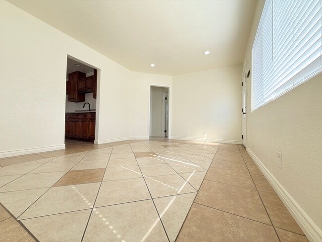 Photo - Spacious 4-Bedroom, 2-Bath Gated Home with Garage & Private Backyard
