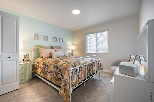 This spacious bedroom offers a peaceful retreat with a modern layout and calming vibes.