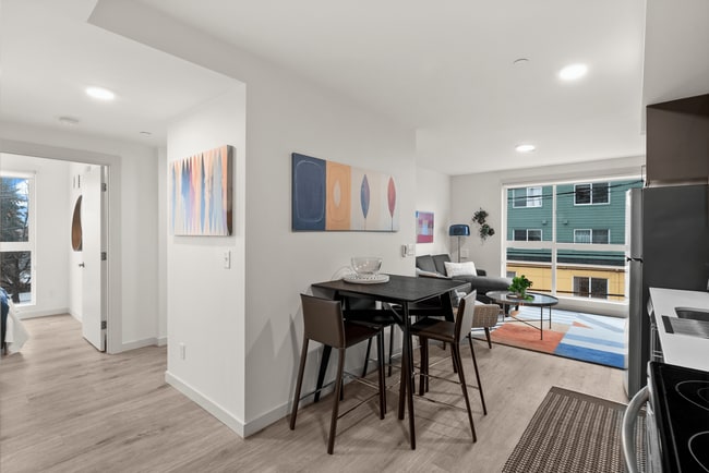 Open-concept layout with dining and living areas.