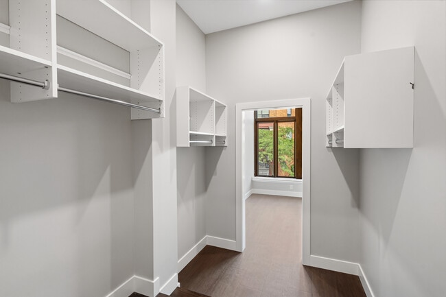 Walk-in closet with view to bedroom