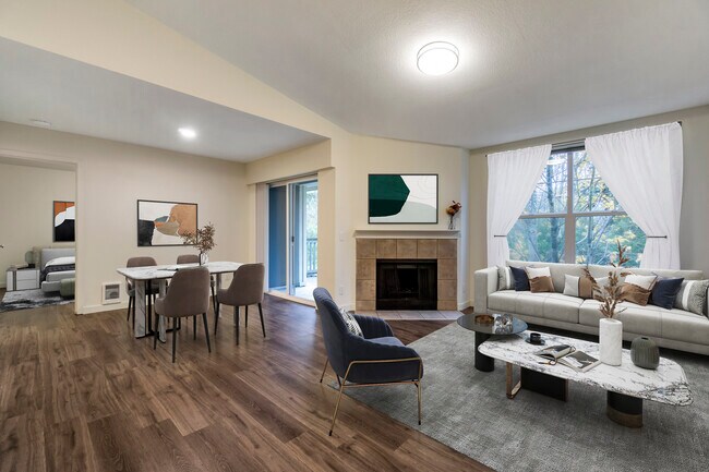 Renovated Package I dining and living room with hard surface flooring - Avalon at Bear Creek
