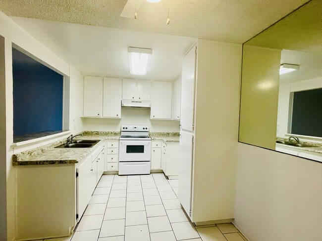 Photo - Charming 2-Bedroom, 1.75-Bathroom Unit with Garage, Patio & Community Amenities! Unit 208