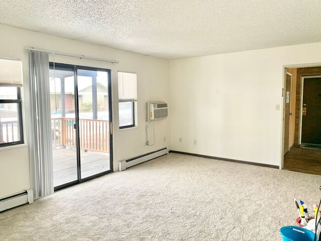 Building Photo - Spacious 2-Bedroom Apartment with Massive Private Deck, Covered Parking & Utilities Included!