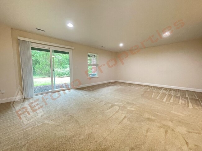 Photo - Beautiful 3 Story 3 Bedroom Townhouse with Huge 1st Floor Flex Space with Access to Patio + 2 Car...