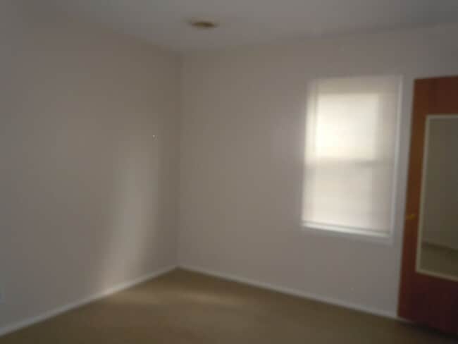 Photo - Two Bedroom House with Main Floor Laundry Hookups and Garage w/ Opener!