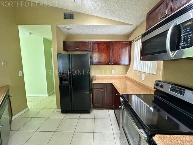 Photo - Charming 2-Bed, 2-Bath Home with Fenced Ya...