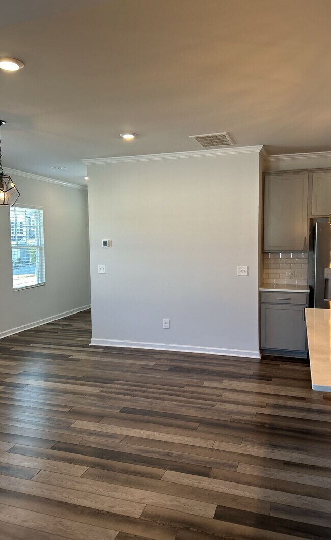 Photo - Modern townhome with high-end finishes throughout, minutes to 540 and walkable to great shopping.