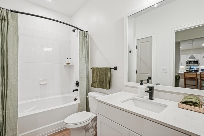 Bathroom with Quartz Countertop and Soaking Tub