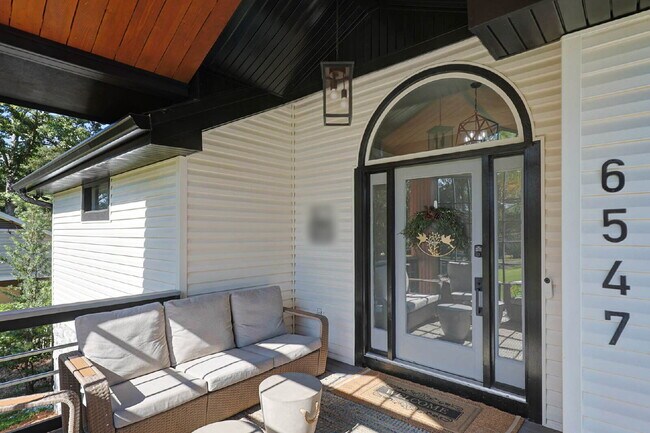 Photo - COMING SOON · Designer Renovation · Covered Deck Pavilion · 2-Car Garage · Lawn Care Included
