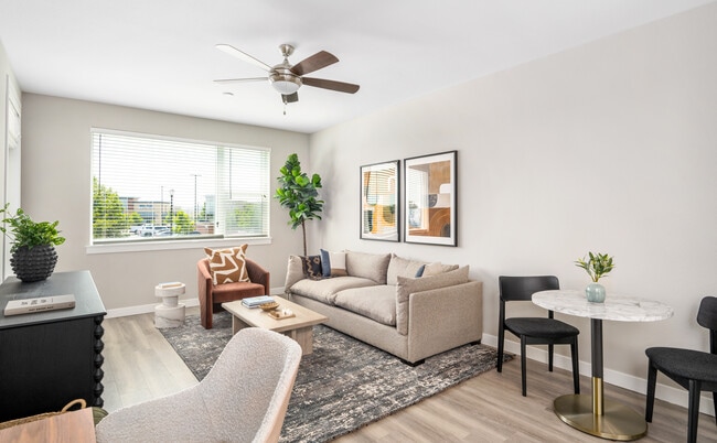 Finish Package II Living area with hard-surface vinyl plank flooring throughout and ceiling fan