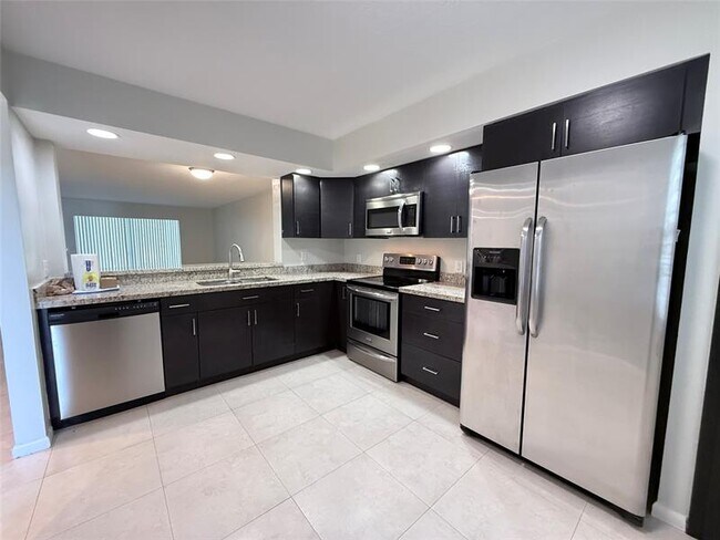 Building Photo - 1201 SW 128th Terrace Unit 104 E
