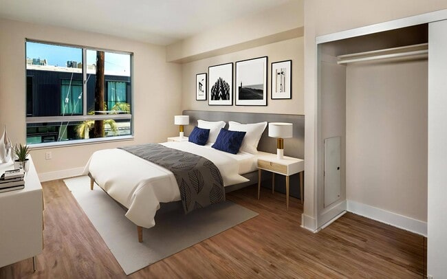 Room for a bed, two nightstands and a desk by the window as well.