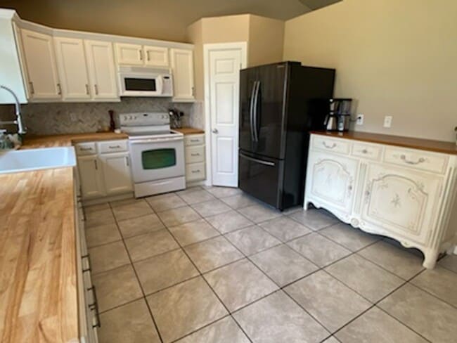 Photo - Sunny and spacious 3 bed, 2.5 bath house with living and family room, with huge back yard!