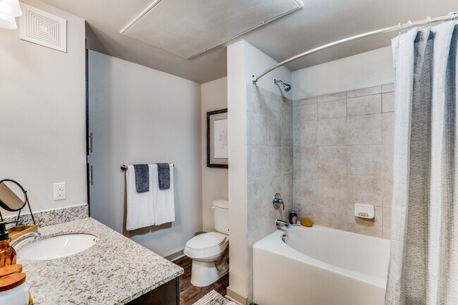 large bathroom with garden tub and granite countertops - Junction 15