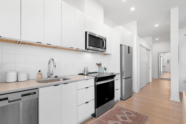 Photo - Modern downtown condo studio with private balcony & parking space.