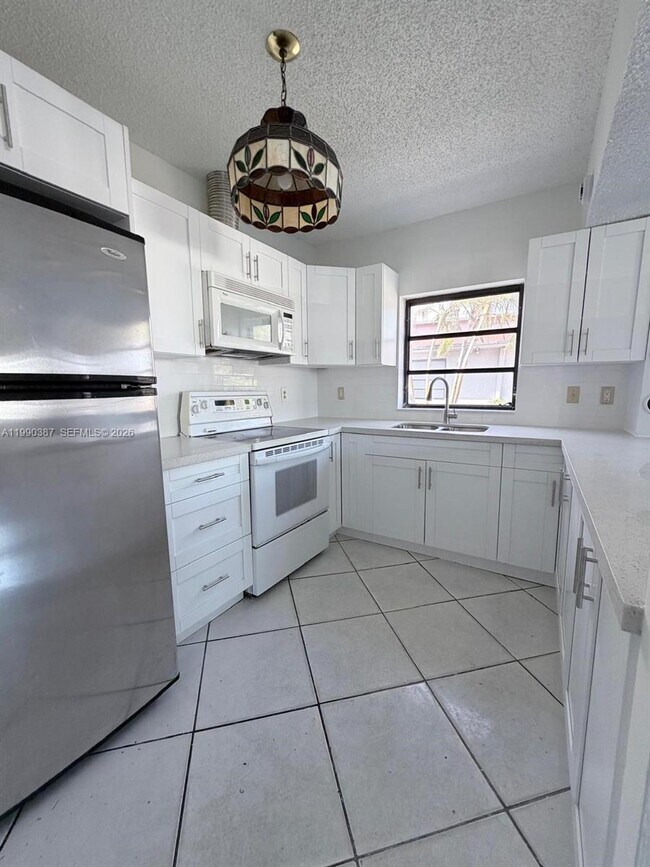 Photo - 450 NW 43rd Pl Unidad front