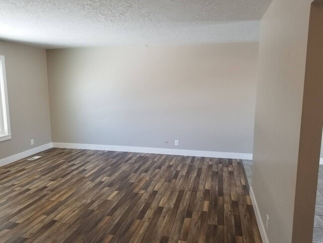 Photo - Spacious 5-Bedroom Magna Home with Deck and Ample Parking