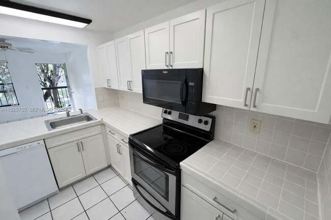 Building Photo - 14851 SW 104th St Unit 11-21