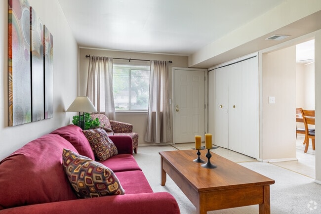 3BR, 1BA - 1,050SF - Living Room - The Hamptons of Brownstown Apartments