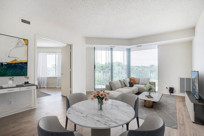 Renovated Package II dining and living room with hard surface flooring